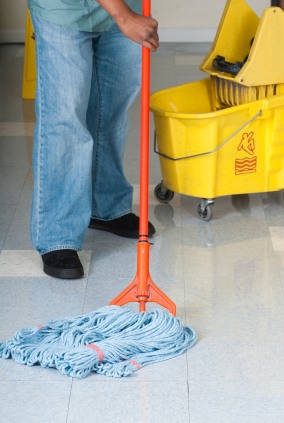 Baza Services LLC janitor in Gardendale, AL mopping floor.